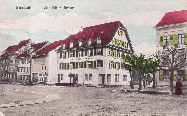 Die nachkolorierte Fotografie von 1920 zeigt den früheren Gasthof zur Alten Braue, das heutige Gemeindehaus. Bild Sammlung AGNHS